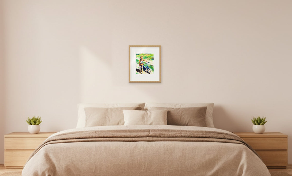 Plavi bicikl – framed drawing (approx. 39 × 45 cm) shown at true scale above a double bed