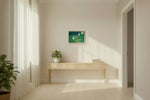 Two girls on swings in a green garden, 57.8 x 40 cm matte canvas print on a natural maple frame, shown at true scale above a console table